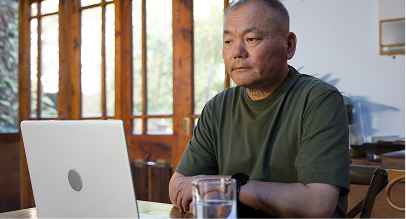 man looking at laptop