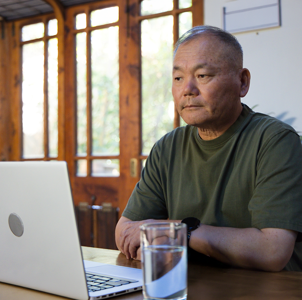 man looking at laptop
