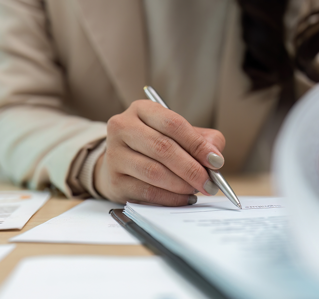 person signing a document